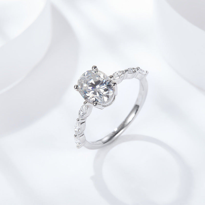 Side Stone Oval 4 Claw Moissanite Engagement Ring